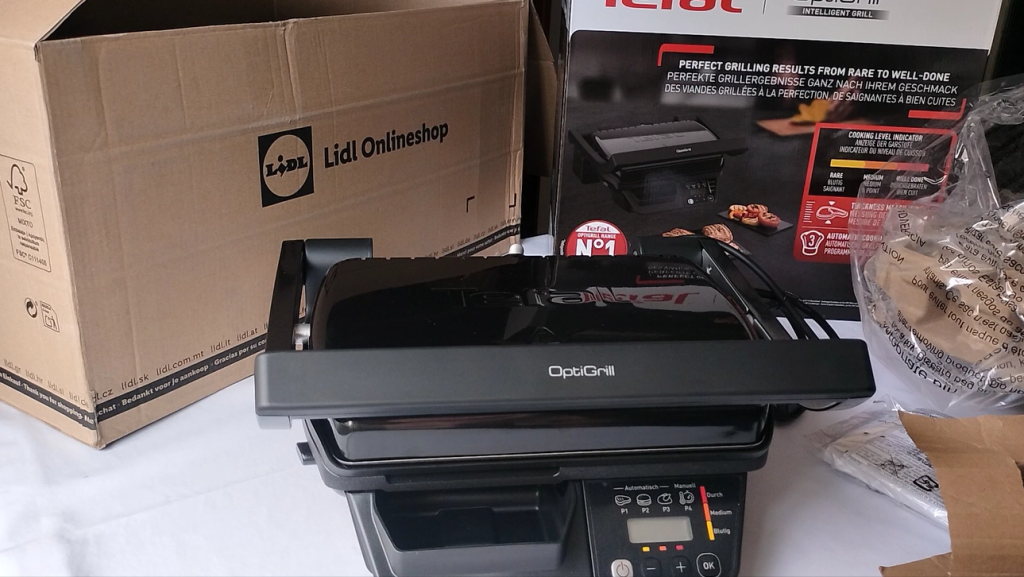La caja de la Tefal OptiGrill GC7P08 junto al embalaje de Lidl.